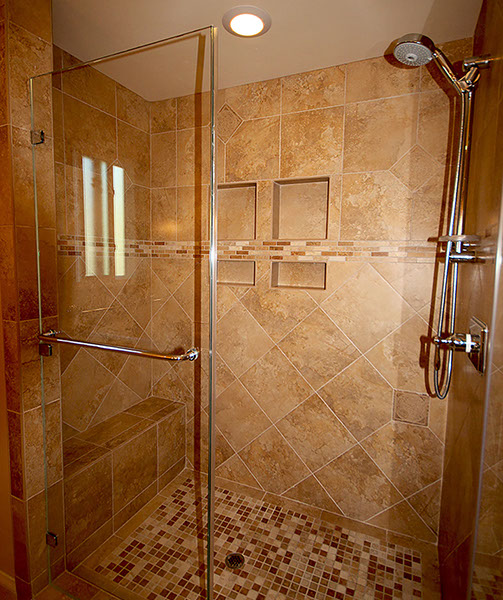 Modern stone tile shower stall, design and installation.