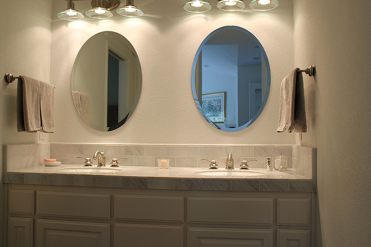 Stone tile counter and backsplash in bathroom.