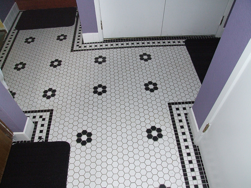 Hexagonal ceramic tile bathroom flooring.