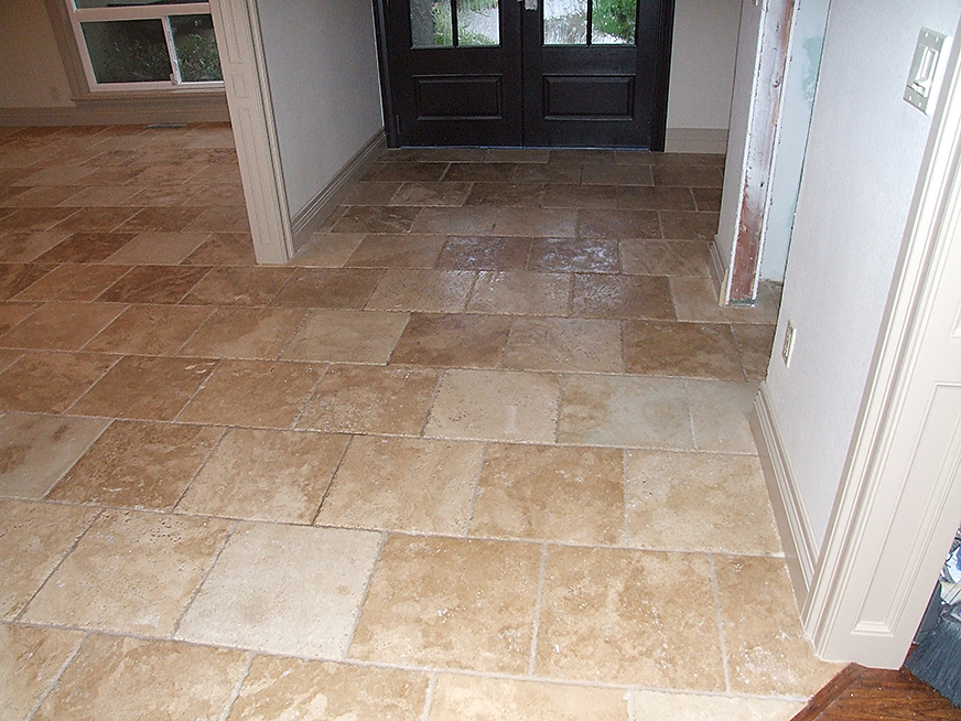 Stone tile floor installation.
