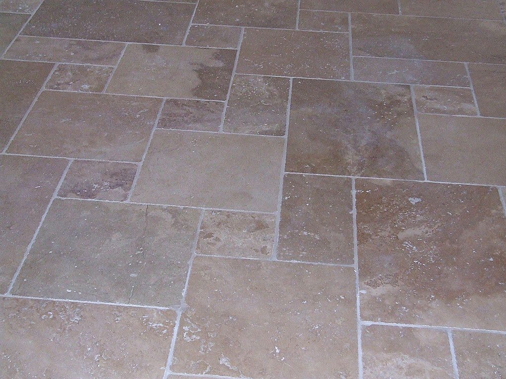 Stone floor tile design and installation.