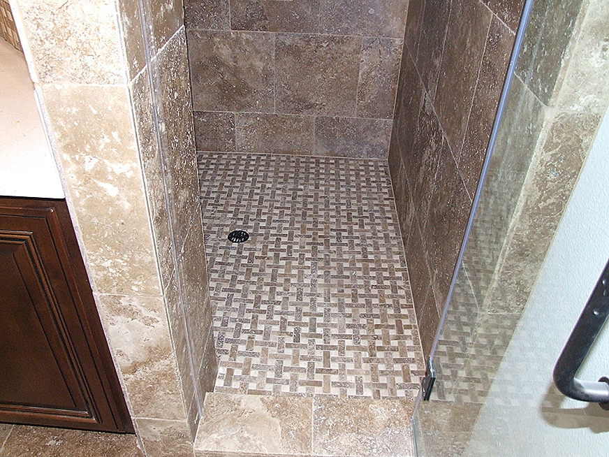 Shower stall stone tiling work.