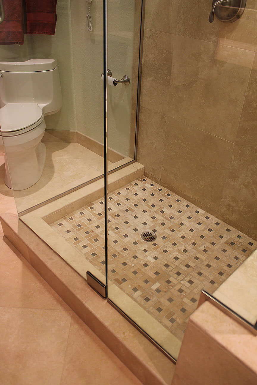 Patterned stone tile floor for shower stall.